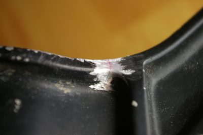 cracked swingarm closeup